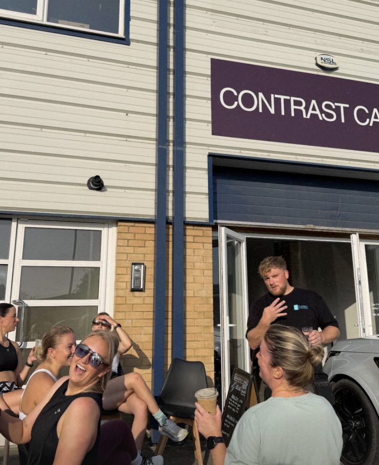 Members outside Contrast Café after a session