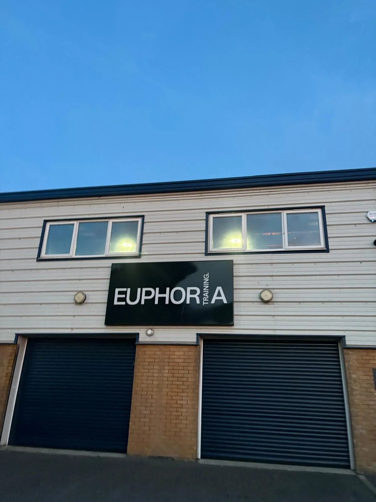 Outside the unit with the Euphoria sign