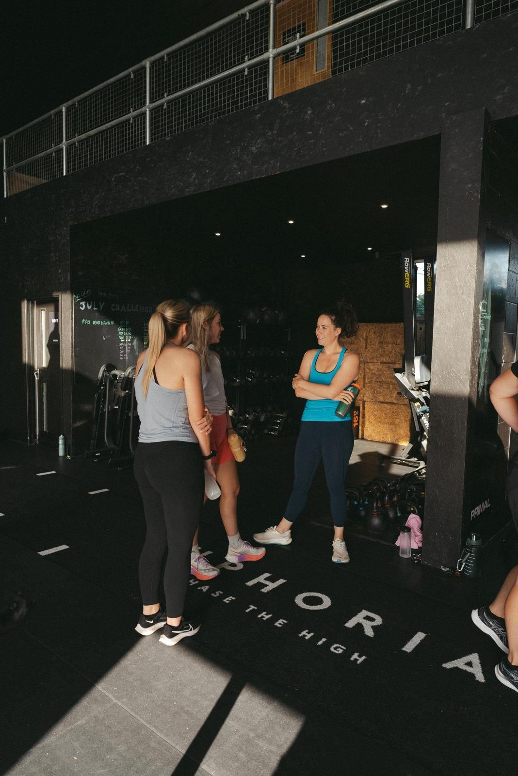 Members talking on the gym floor