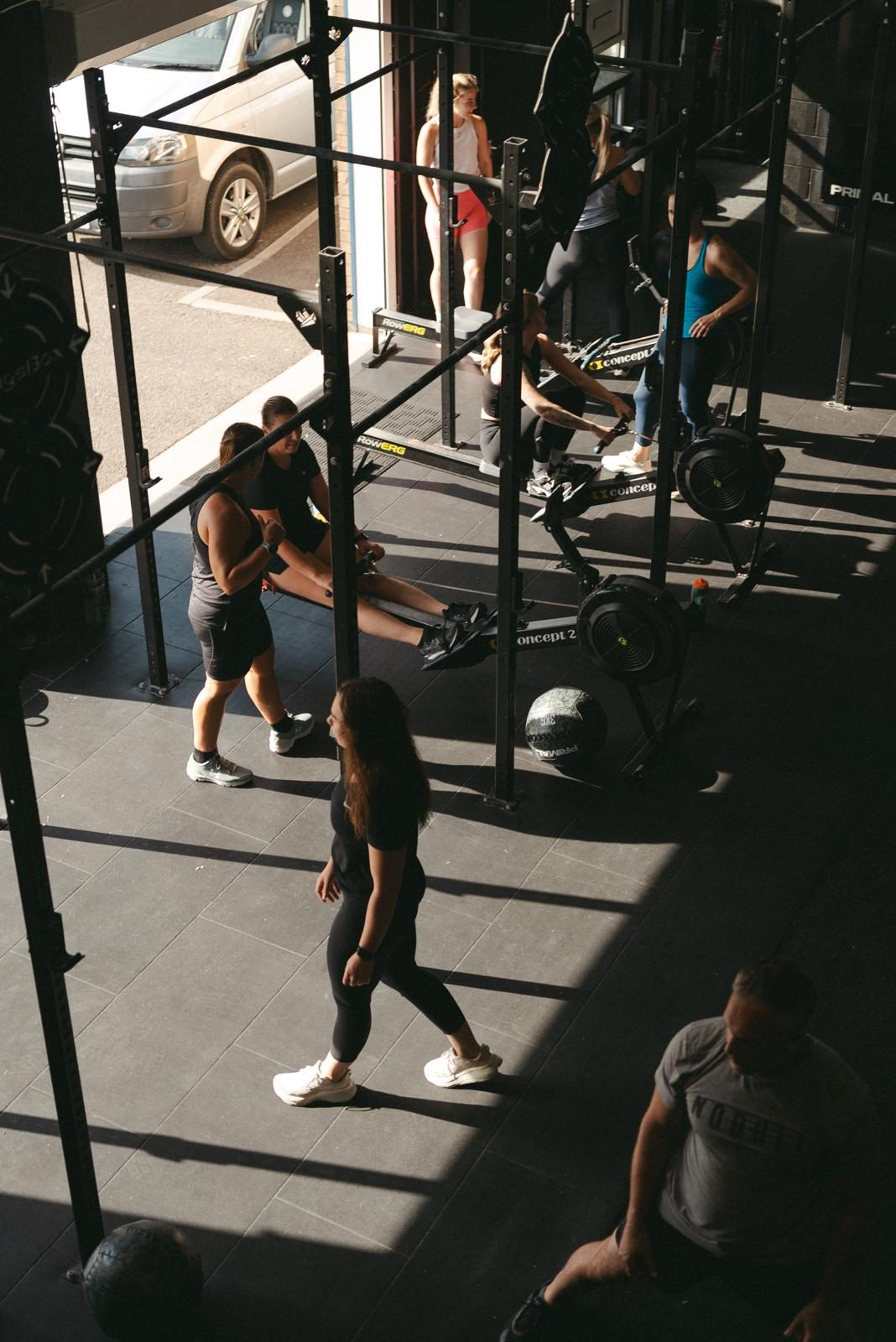 The training floor at Euphoria, rigs and rowers with the roller door open
