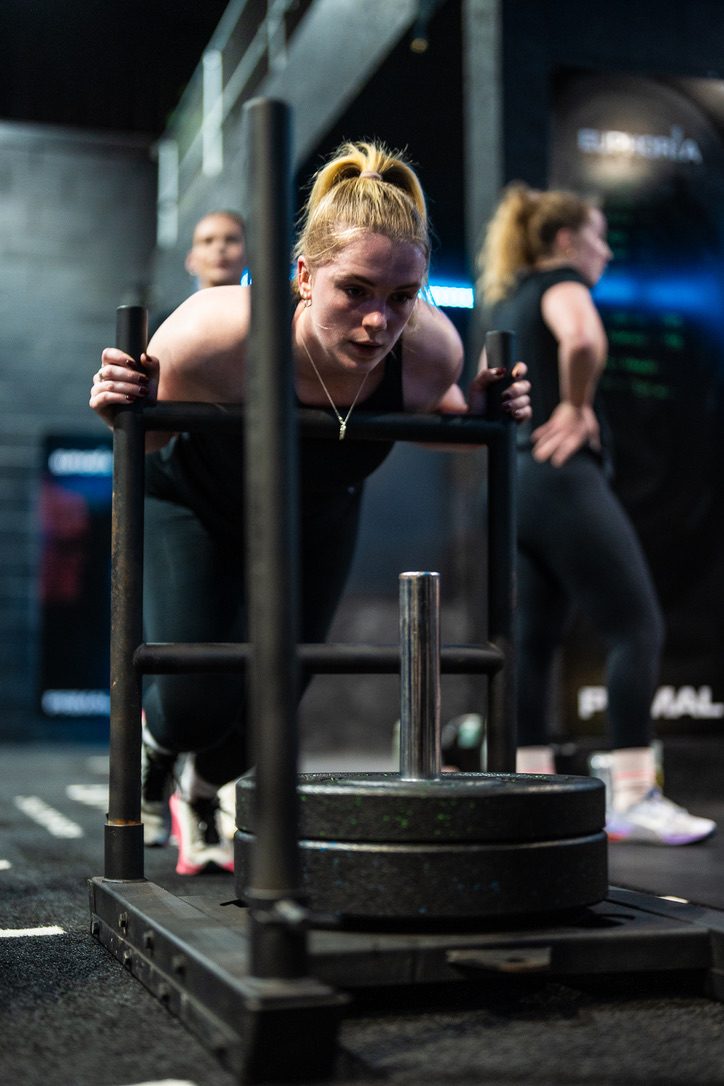 Member pushing the sled
