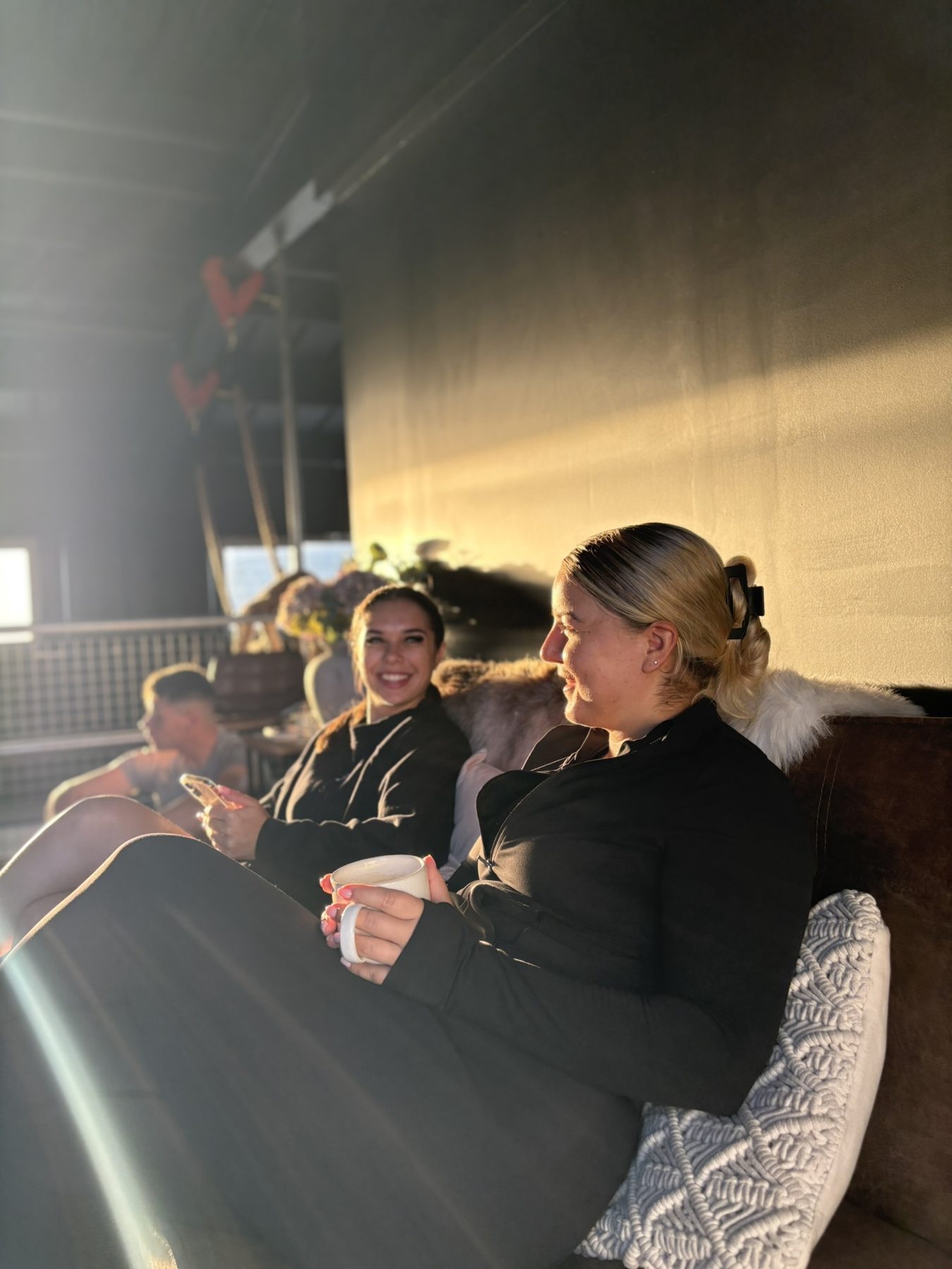 Members relaxing in the social space after a session
