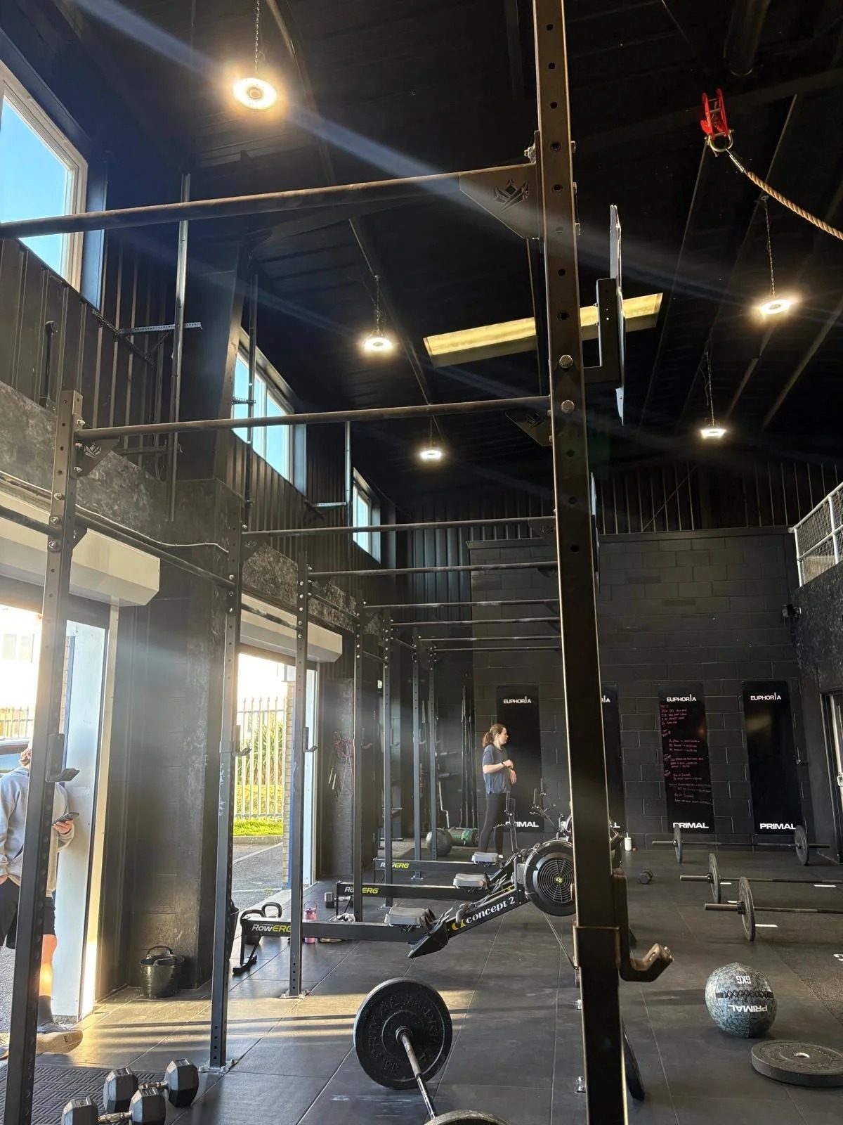 Rig and barbells with the roller door open